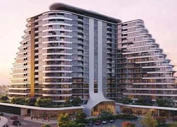 Cascada towers at Waada, Dubai South, showing stepped facade design and podium pool terrace